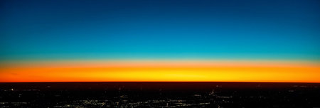 Dramatic sunset over the horizon with Tokyo in the foregroundの写真素材