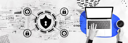 Cyber security theme with person using a laptopの写真素材