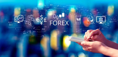 Forex trading concept with person using a smartphone at nightの写真素材