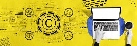 Copyright concept with person using a laptopの写真素材