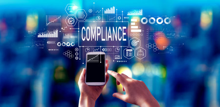 Compliance theme with person using a smartphone at nightの写真素材