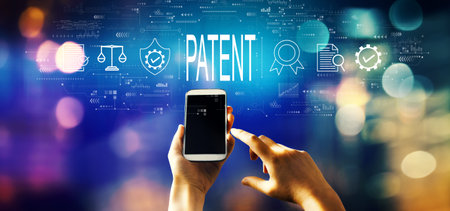 Patent concept with person using smartphoneの写真素材