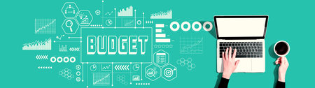 Budget theme with person using a laptopの写真素材