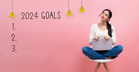 2024 goals with woman using a laptopの写真素材