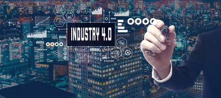 Industry 4.0 theme with businessman in city at nightの写真素材