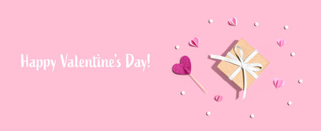 Valentines Day message with a small gift box and heartsの写真素材