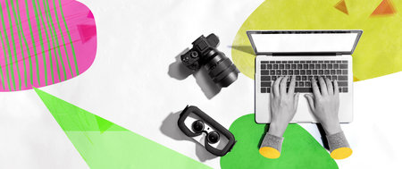 Laptop computer with a SLR camera and VRの写真素材