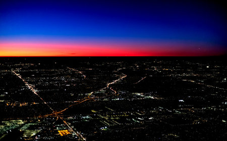 Dramatic sunset over the horizon with Tokyo in the foregroundの写真素材
