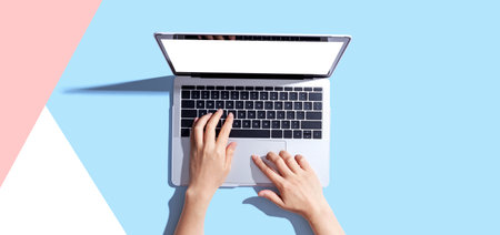 Person using a laptop computerの写真素材