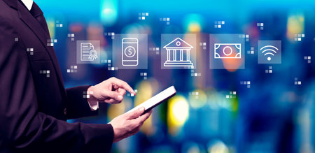 Online banking concept with businessman using a tablet computerの写真素材