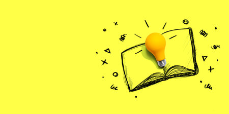 An open book with a lightbulbの写真素材