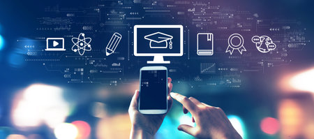 E-learning concept with a smartphone in city lights at nightの写真素材