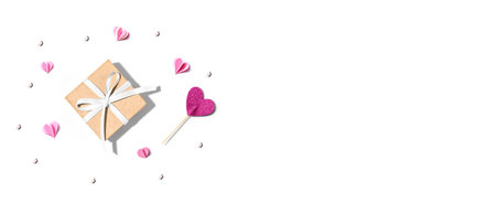 Gift box with pink paper heartsの写真素材