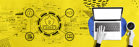 Cyber security theme with person using a laptopの写真素材