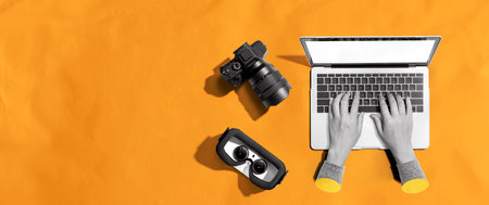 Laptop computer with a SLR camera and VRの写真素材