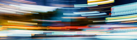 City motion blurred intersection background at night