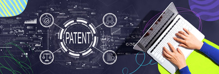 Patent concept with person using a laptopの写真素材
