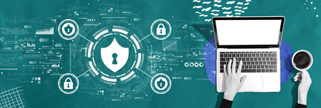 Cyber security theme with person using a laptopの写真素材