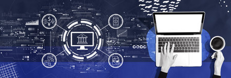 Cryptocurrency fintech theme with person using a laptopの写真素材