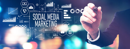 Social media marketing theme with a businessman holding a markerの写真素材