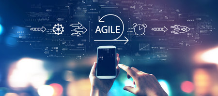 Agile concept with a smartphone in city lights at nightの写真素材