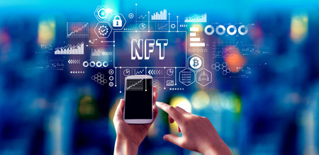 NFT theme with person using a smartphone at nightの写真素材