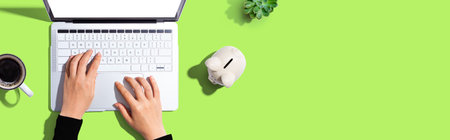 Laptop computer with piggy bankの写真素材