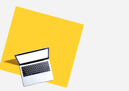 Laptop computer with shadow from aboveの写真素材
