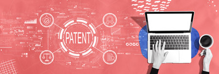 Patent concept with person using a laptopの写真素材