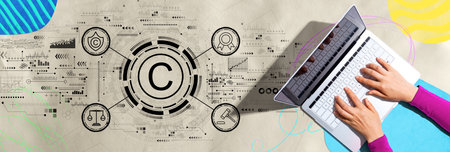 Copyright concept with person using a laptopの写真素材
