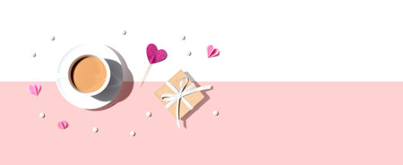 A cup of coffee with a gift box and heartsの写真素材