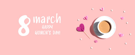 Happy womens day message with a cup of coffee and paper heartsの写真素材