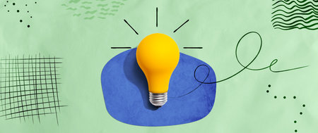 Yellow light bulb with handwritten sketchの写真素材