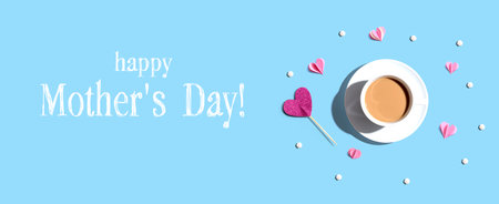 Happy mothers day message with a cup of coffee and paper heartsの写真素材