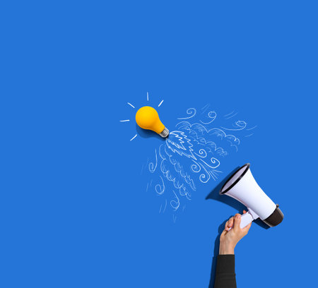 Attention and announcement concept with an idea light bulb flying to the sky like a rocketの写真素材
