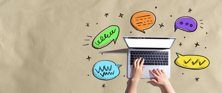 Speech bubbles and a laptopの写真素材