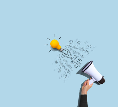 Attention and announcement concept with an idea light bulb flying to the sky like a rocketの写真素材