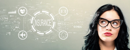 Insurance concept with young businesswomanの写真素材