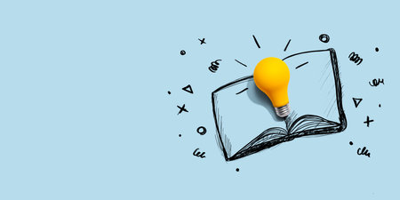 An open book with a lightbulbの写真素材