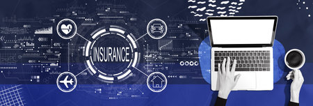 Insurance concept with person using a laptopの写真素材
