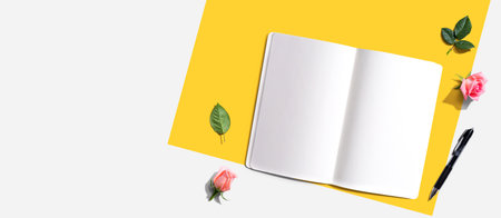 Blank open notebook with a pen from aboveの写真素材