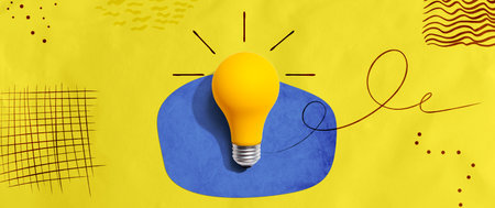 Yellow light bulb with handwritten sketchの写真素材