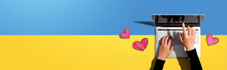 Laptop computer with craft heart drawingsの写真素材