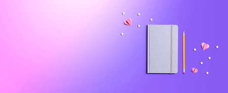 Gray notebook with paper hearts