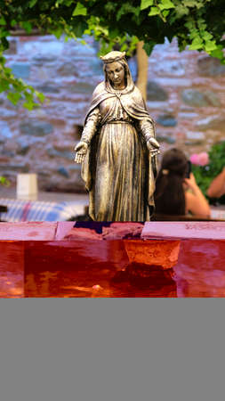Bronze statue of the Virgin Mary, a symbol of the city of Seville, emblematic city and capital of the region of Andalusia, in the south of Spainの写真素材