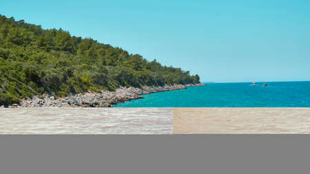 Panoramic view of the sea and the beach on a sunny summer dayの写真素材