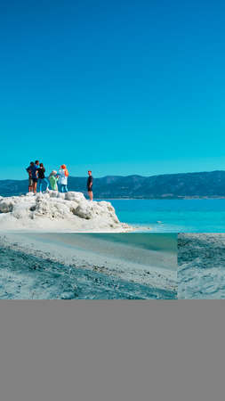 Tourists on the beach of Pamukkale, Turkeyの写真素材