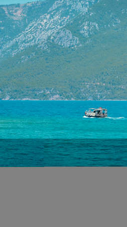 Boat on the turquoise water of the Adriatic Sea in Croatia
