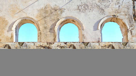 Old arches on the wall of an ancient building in Rhodes, Greeceの写真素材