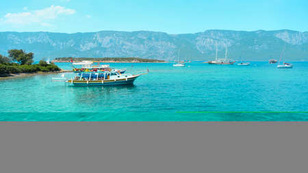 Fishing boat on the turquoise water of the Adriatic Seaの写真素材